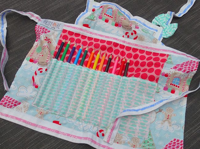 Childs apron with pencils in red dots