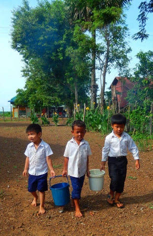 Restore One Pre School kids carrying water